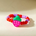 Close-up of a beaded strawberry ring featuring red and purple resin beads and a cute pendant - Pink Strawberry Style (31025-ring-rp)