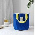 Close-up of quilted navy canvas bag with yellow straps and cute alpaca patch detail - Blue Handbag