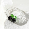 Macro view of a handmade beaded flower ring with colorful faceted transparent beads - Black Green Contrast Faceted Style (31027-ring-black)