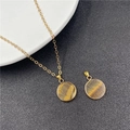 Minimalist gold necklace featuring a round tiger eye pendant with golden bezel - Tiger's Eye