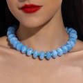 Detail shot of colorful acrylic beaded necklace with light blue marble texture on model - Sky Blue Marble(31101)