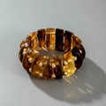 Macro detail of acrylic tube bracelet featuring amber and tortoiseshell resin segments - Vintage Wide Amber Stretch Bracelet (30827)