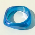 Detail view of a thick sky blue resin bracelet with translucent aurora glitter finish - Sky Blue Thick Aurora Iridescent Style (31618-bra-blue)