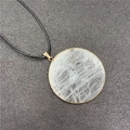 Natural white moonstone pendant necklace with gold rim and black woven cord - Labradorite