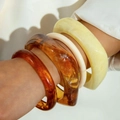 Fashionable 4-piece acrylic chunky bangle set in amber and cream tones for women - Amber/White/Yellow 4-Piece Chunky Bangle Set (31658)