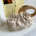 Chic cream floral lace makeup bag with 3D rose texture and pearl zipper detail - Beige