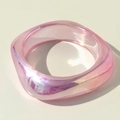 Close-up of pink translucent resin bangle with aurora glitter and square round edges - Pink Iridescent Rounded Square Style (31618-bra-pink)