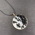 Black marble stone pendant necklace with gold metal edging and minimalist black cord - Zebra Stone