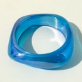Macro shot of wide square resin bangle with iridescent aurora finish in bright royal blue - Iridescent Blue