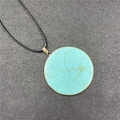 Turquoise pattern round pendant necklace with golden metal trim and black wax cord - Synthetic Turquoise