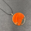 Red jasper circular stone necklace with golden rim and black cord pendant for women - Rainbow Stone