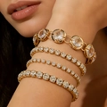 Set di quattro bracciali tennis dorati con cristalli scintillanti per uno stile a strati - Set di 4 Bracciali in Strass Dorati (31295-bra-G-EP)