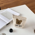 Close-up of cream fuzzy bear makeup pouch featuring soft texture and Happy Bear embroidery - Off White