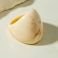 Macro shot of chunky acrylic ring with cream and amber marble texture on stone backdrop - Beige Amber(31760)