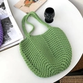 Handmade green woven crochet tote bag with thick rope texture on a white table - Green