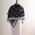 Fashionable black and white cashmere scarf with bee pattern and fringed edges on a mannequin - Medium-Long Style / Black