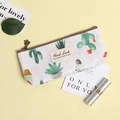 Cute white canvas stationery pouch with green cactus print and Good Luck label - Cactus