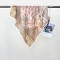 Elegant floral silk scarf in warm orange-brown earthy tones with white rolled edges - Yellow