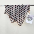 Elegant silk scarf featuring colorful horse print and striped pattern draped on a metal bar - Brown Edge / 68*68cm
