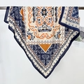 Navy and orange paisley pattern silk square scarf hanging on a display stand - 90*90cm / Dark Blue