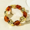 Detail of amber resin beads and textured gold metal beads on an elastic bracelet - Gold Irregular Beads and Amber Beads Bracelet (31600)