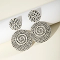 Detailed close-up of textured silver round drop earrings with hammered finish and swirls - Silver Double Disc Spiral Hammered Style (29094-S)
