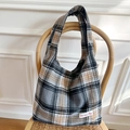 Classic plaid tote bag with Scottish wool pattern on a vintage wooden chair - Gray Woolen Plaid