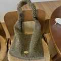 Close-up of olive green plush hobo bag texture with a gold handmade metal plate detail - Moss Green