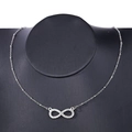 Close-up of infinity symbol pendant with rhinestones on a delicate silver bead chain - Infinity Rhinestone Pendant Necklace (P-564) / Silver