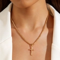Close-up of a gold-plated cross pendant necklace styled on a model with white suit jacket - Polished Cross Pendant Necklace (30451) / Gold