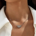 Close-up of elegant butterfly pendant necklace with micro-pave crystals on model collarbone - Butterfly Rhinestone Pendant Necklace (p-564-2)