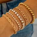 Détail d'un lot de 6 bracelets dorés superposés avec cristaux et chaînes Figaro - Ensemble de 6 Pièces Or (30763-bra-G-EP)