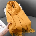 Ginger yellow knitted cashmere-like scarf for women featuring long tassel edge details - Turmeric