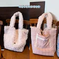 Pink reversible lamb wool and plaid tote bag showing double-sided design - Pink (Reversible)