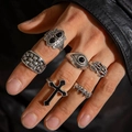 Macro detail of six-piece gothic punk ring set with skull and cross motifs on a hand - 6-Piece Hardcore Gothic Style (26190-ring-S-1)