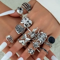 Gothic punk silver rings set with spider, skull and evil eye motifs on model hand - Gothic Spider Evil Eye Skeleton Hand Style (31095-ring-S)