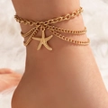 Close-up of golden layered anklet featuring a starfish pendant on a soft white background - Gold Starfish Style (20014-starfish)