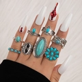 Close-up of 8pcs bohemian vintage silver rings set with turquoise and eagle motifs - Sunflower Eagle 8-Piece Set (23443-green)