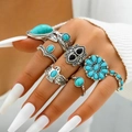8-piece vintage boho ring set with turquoise stones and eagle relief worn on hand - Ethnic Green Gem Eagle Sun Style (23443-green)