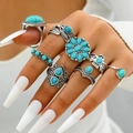 Bohemian style 8-piece vintage silver ring set with turquoise on model's hand - Lake Blue Gem Solar Flower Style (23557-blue)