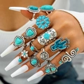 13-piece bohemian silver-finish ring set with turquoise stones on model's hand - Bohemian Cactus Lotus Style (26425-blue)