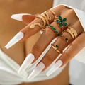 Bohemian gold ring set featuring snake and flower designs with emerald-like stones - Gold Green Feather Floral Set (22481-gold)