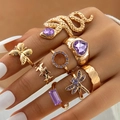 7-piece gold snake ring set featuring purple crystals and butterfly heart designs - Gold And Purple Gemstone Decor Assortment (22812-gold)