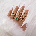 Five-piece gold snake ring set with green gemstones and rhinestones on plush white background - Five-Piece Snake Style (With Green Rhinestone) / Bright Gold (24415-gold)