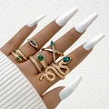 Set of 6 gold snake rings with evil eye and green crystals on female hand - Bright Gold (25421-gold)