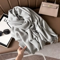 Light gray ribbed knit scarf with fringes on a leather sofa with lifestyle accessories - 67cmx180cm / Light Gray
