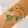 Detail of four-piece gold bohemian bracelet set with turquoise stones and evil eye charm - Evil Eye Turquoise Color 4-Piece Set (30760-bra-G)
