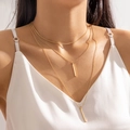Three-layer minimalist gold necklace with geometric bar pendants on a female model - Gold (28967)