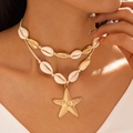Detailed close-up of a layered shell necklace featuring a gold starfish pendant and beads - Gold Starfish Double Style (29117-G)