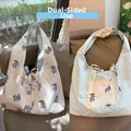 Detail view of reversible tote bag with bear print bubble fabric and drawstring closure - Blue Sunglasses Dog Reversible Solid